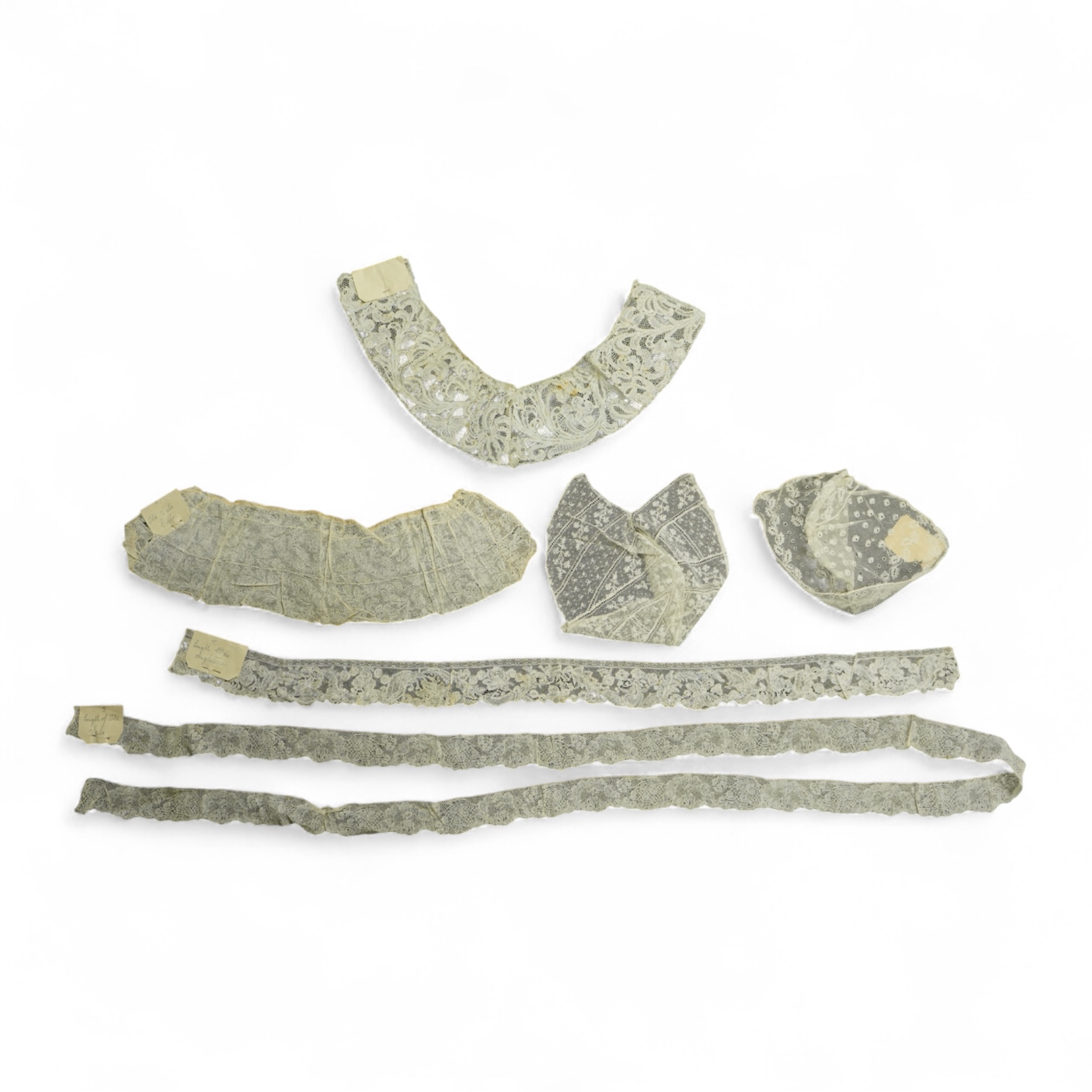 Various lengths of 18th and 19th century lace trimming and two needle run bonnets. Including a collar made from two rows of 18th century Valenciennes lace, a length Valenciennes lace, a shorter length of Pointe de Anglet